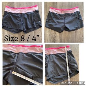 Lululemon size 8 shorts EUC dark grey w pink waist band